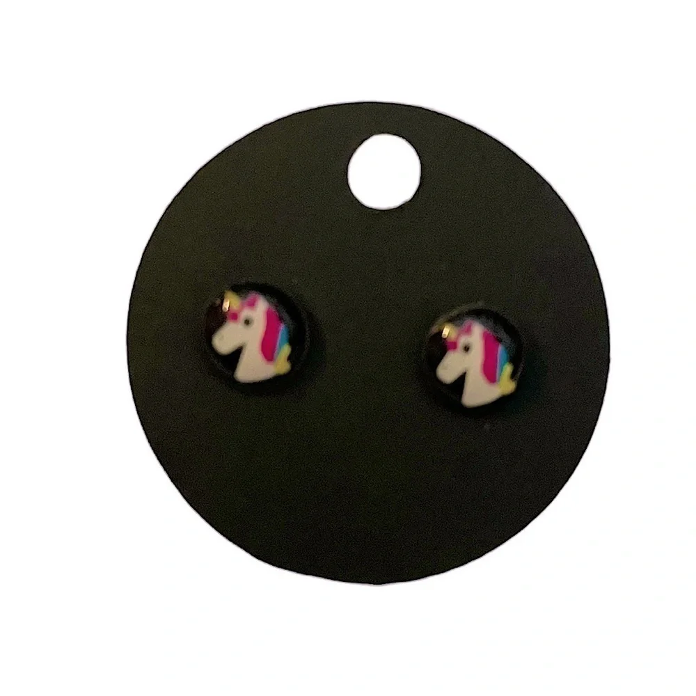 Unicorn stud earrings on black background